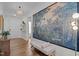 Elegant entryway with hardwood floors, a decorative bench, and eye-catching wall art at 3215 Jones Lake Rd, Fuquay Varina, NC 27526