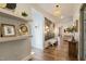 Elegant entryway with hardwood floors, decorative shelving, and a view into the living room at 3215 Jones Lake Rd, Fuquay Varina, NC 27526