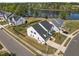 Beautiful exterior view of modern homes near a tranquil lake at 3215 Jones Lake Rd, Fuquay Varina, NC 27526