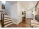 Welcoming foyer with hardwood floors, staircase, and stylish decor at 3215 Jones Lake Rd, Fuquay Varina, NC 27526