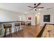 Open game room with bar seating, foosball table, and shuffleboard, perfect for entertaining guests and relaxation at 3215 Jones Lake Rd, Fuquay Varina, NC 27526