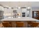 Bright kitchen with a large island, pendant lighting, and stainless steel appliances, perfect for cooking and entertaining at 3215 Jones Lake Rd, Fuquay Varina, NC 27526