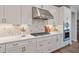 Close up on the kitchen features white cabinets, stainless appliances and a stylish backsplash at 3215 Jones Lake Rd, Fuquay Varina, NC 27526