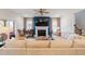 Bright living room features a fireplace and comfortable, oversized sectional sofa with stylish decor at 3215 Jones Lake Rd, Fuquay Varina, NC 27526