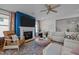 Stylish living room featuring a fireplace, plush sofa, and unique round wooden coffee table at 3215 Jones Lake Rd, Fuquay Varina, NC 27526