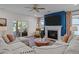 Inviting living room with a cozy fireplace, comfortable seating, and elegant decor at 3215 Jones Lake Rd, Fuquay Varina, NC 27526