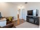 Comfortable living room boasts a fireplace, TV, and stylish decor at 3215 Jones Lake Rd, Fuquay Varina, NC 27526