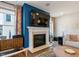 Cozy living room with a fireplace, mounted TV, and comfortable seating area at 3215 Jones Lake Rd, Fuquay Varina, NC 27526