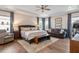 Spacious main bedroom with trey ceiling, hardwood floors, and comfortable seating area for relaxation and rest at 3215 Jones Lake Rd, Fuquay Varina, NC 27526