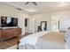 Inviting main bedroom with hardwood floors, contemporary dresser, and easy access to the main bathroom at 3215 Jones Lake Rd, Fuquay Varina, NC 27526