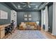 Comfortable home office featuring a ceiling fan, built-in bookcase, and a cozy seating area at 3215 Jones Lake Rd, Fuquay Varina, NC 27526