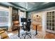 Bright home office featuring custom built-ins, a spacious desk, and natural light at 3215 Jones Lake Rd, Fuquay Varina, NC 27526