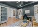 Stylish home office with a built-in desk, bookcase, and ample natural light at 3215 Jones Lake Rd, Fuquay Varina, NC 27526