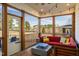 Screened porch featuring a seating area, a fire pit, and a view of a fenced backyard at 3215 Jones Lake Rd, Fuquay Varina, NC 27526