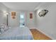 Comfortable bedroom features hardwood floors and a calming color palette at 360 Linden Close, Pittsboro, NC 27312