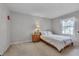 Cozy bedroom with natural light and plush carpeting at 360 Linden Close, Pittsboro, NC 27312