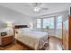 Bright bedroom with hardwood floors, a large window, and ample natural light at 360 Linden Close, Pittsboro, NC 27312