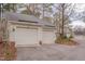 Attached two-car garage with ample parking space on a paved driveway at 360 Linden Close, Pittsboro, NC 27312