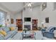 Spacious living room with a fireplace, high ceilings, and a cozy seating area at 360 Linden Close, Pittsboro, NC 27312