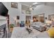 Open-concept living room with fireplace, hardwood floors, and a view of the upstairs at 360 Linden Close, Pittsboro, NC 27312