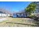 Charming single-story home with a cozy front porch and a well-manicured front yard at 407 Iris Bryant Rd, Dunn, NC 28334