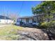 Quaint single-story home with a covered front porch, showcasing the exterior at 407 Iris Bryant Rd, Dunn, NC 28334