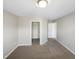 A spacious bedroom with neutral walls and carpeted floors, with an adjacent closet and easy access to the hallway at 480 Stonewall Dr, Mebane, NC 27302