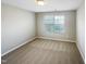 Serene bedroom with carpet, a window, and neutral wall color; perfect for relaxation and personalization at 480 Stonewall Dr, Mebane, NC 27302