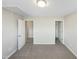 A spacious bedroom with neutral walls, carpeted floors, and an ensuite bathroom with a walk-in closet at 480 Stonewall Dr, Mebane, NC 27302