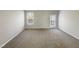 Bright, airy empty room with neutral walls, carpeted floors, and lots of natural light at 480 Stonewall Dr, Mebane, NC 27302