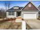 Charming single-story home featuring a two-car garage, landscaped yard, and traditional architectural details at 480 Stonewall Dr, Mebane, NC 27302