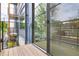 Balcony with wood flooring, metal railings and view of surrounding area at 521 N Mangum St # 12, Durham, NC 27701