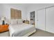 Bright bedroom featuring a unique headboard design and ensuite bathroom at 521 N Mangum St # 12, Durham, NC 27701