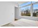Bright bedroom featuring a large window with views of the neighborhood at 521 N Mangum St # 12, Durham, NC 27701