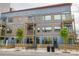 Modern exterior of a multi-story building with wood accents and landscaping at 521 N Mangum St # 12, Durham, NC 27701