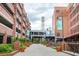 Charming brick buildings with landscaped walkway and visible water tower in the background, making for a visually appealing space at 521 N Mangum St # 12, Durham, NC 27701