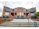 Exterior shot of Durham Bulls Athletic Park, a brick building with multiple entrances and signage for events and tickets at 521 N Mangum St # 12, Durham, NC 27701