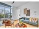 Living area with view through sliding glass doors, comfortable seating and modern accents at 521 N Mangum St # 12, Durham, NC 27701