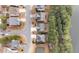 An aerial view showcases the neighborhood layout with well-maintained homes, landscaping, and a pond at 5213 Orabelle Ct, Raleigh, NC 27606