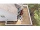 Overhead view showcases the backyard with fenced-in yard and patio with dining furniture at 5213 Orabelle Ct, Raleigh, NC 27606