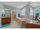 Luxurious bathroom featuring double vanity, soaking tub, and access to a walk-in closet at 5213 Orabelle Ct, Raleigh, NC 27606
