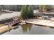 Beautiful lakeside beach area with a bridge, sandy space, and peaceful spots for relaxation by the water at 5213 Orabelle Ct, Raleigh, NC 27606