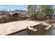 Charming community beach with volleyball net, docks, and scenic views of the lake and surrounding residences at 5213 Orabelle Ct, Raleigh, NC 27606