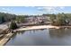 Picturesque lakeside beach area with clear waters, sandy shores, and docks for enjoying water activities at 5213 Orabelle Ct, Raleigh, NC 27606