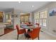 Bright dining area featuring natural light, access to the deck, and contemporary furnishings at 5213 Orabelle Ct, Raleigh, NC 27606