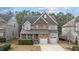 Charming two-story home with stone accents, attached two-car garage, and well-maintained landscaping at 5213 Orabelle Ct, Raleigh, NC 27606