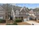 Charming two-story home with stone accents, attached two-car garage, and well-maintained landscaping at 5213 Orabelle Ct, Raleigh, NC 27606
