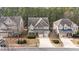 Beautiful two-story home with a stone and siding exterior, complemented by a well-manicured lawn at 5213 Orabelle Ct, Raleigh, NC 27606