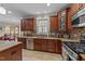 Well-appointed kitchen featuring stainless steel appliances, granite countertops, and custom cabinetry at 5213 Orabelle Ct, Raleigh, NC 27606