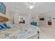Spacious main bedroom with comfortable bed, ceiling fan, and ensuite bathroom access at 5213 Orabelle Ct, Raleigh, NC 27606